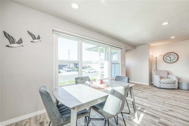 dining space with light wood-type flooring