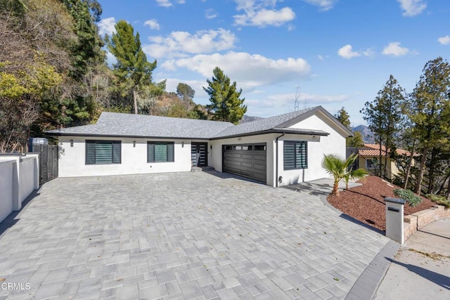 single story home featuring a garage