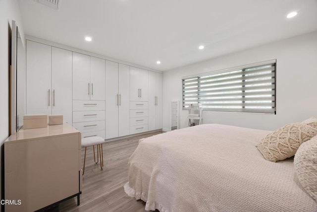 bedroom with light hardwood / wood-style flooring