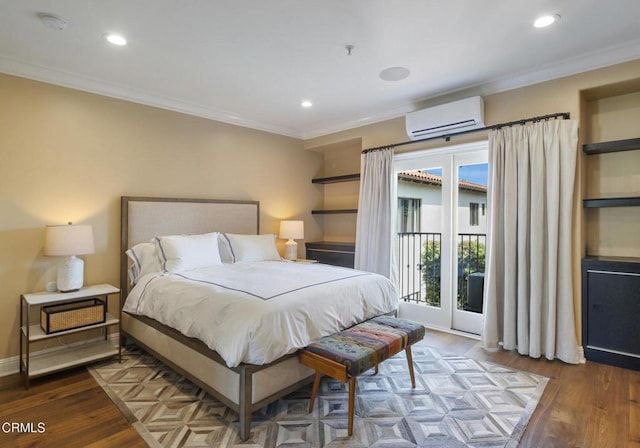 bedroom featuring crown molding, a wall mounted AC, dark hardwood / wood-style floors, and access to outside