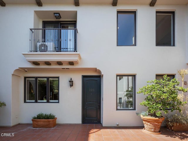 doorway to property with a patio area