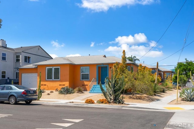 view of front of home featuring a garage