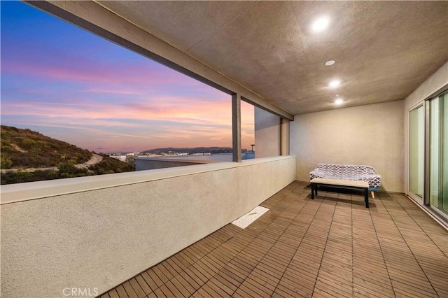 balcony at dusk with a water view