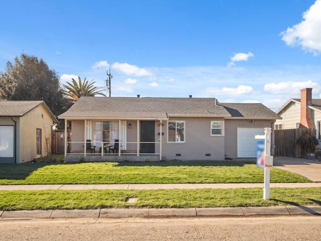 ranch-style house with a garage and a front yard