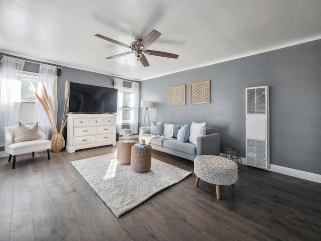 living room with dark hardwood / wood-style floors and ceiling fan