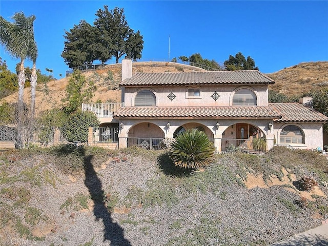 mediterranean / spanish-style home with a mountain view