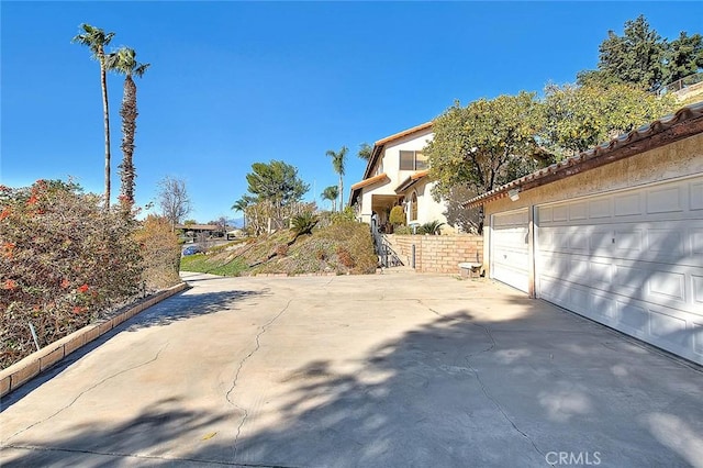 view of side of property featuring a garage