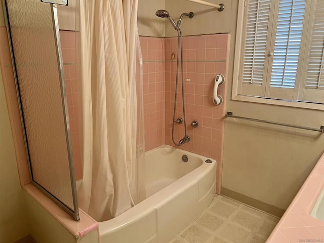 bathroom with shower / tub combo with curtain