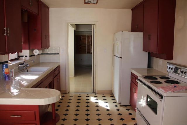 kitchen with sink, white electric stove, tile counters, and decorative backsplash