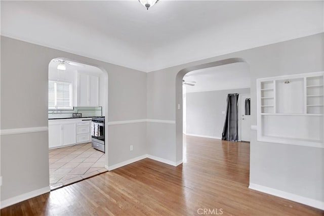 interior space featuring light wood-type flooring and ceiling fan