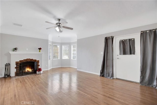 unfurnished living room with light hardwood / wood-style flooring and ceiling fan