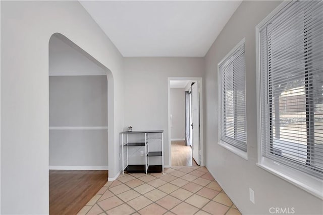 hallway with light tile patterned floors