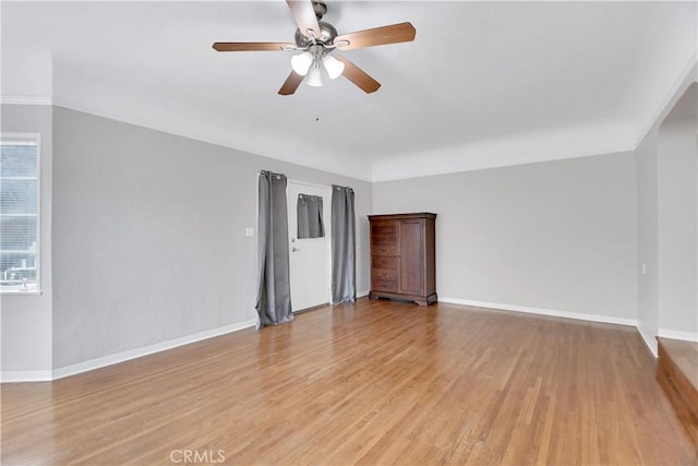 empty room featuring ceiling fan and light wood-type flooring