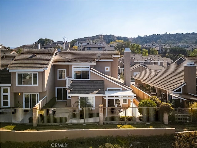 rear view of property with a mountain view