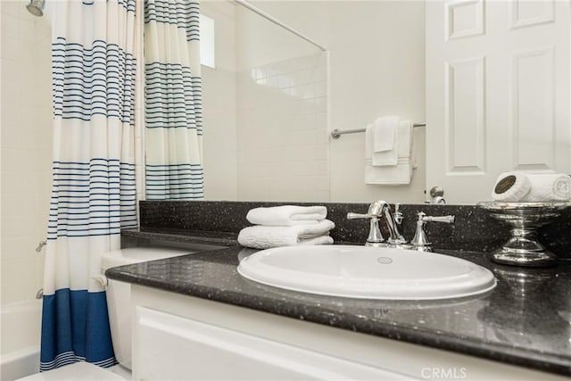 bathroom featuring vanity and shower / bath combination with curtain