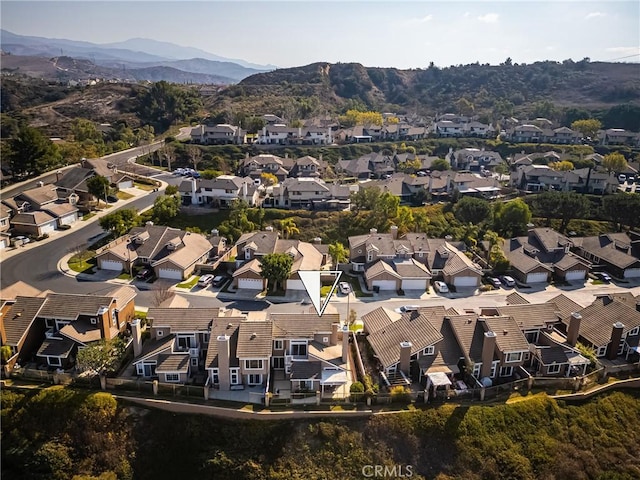 drone / aerial view featuring a mountain view