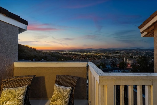 view of balcony at dusk