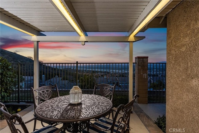 view of patio terrace at dusk