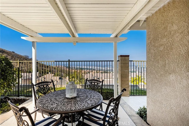 view of patio with a beach view and a water view