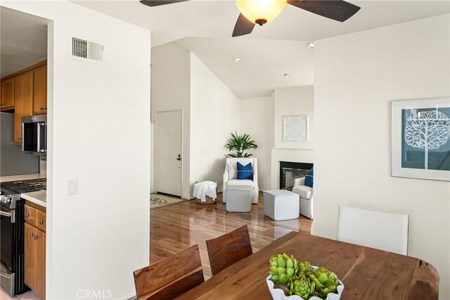 dining space featuring ceiling fan and light hardwood / wood-style floors