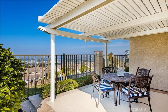 view of patio featuring a water view and a pergola