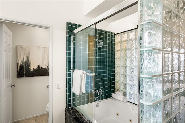 bathroom with shower / bath combination with glass door, toilet, and tile patterned flooring