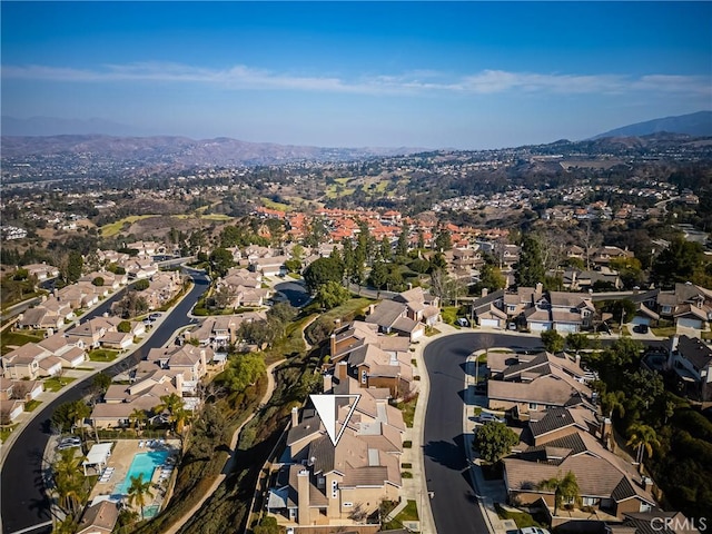 birds eye view of property featuring a mountain view