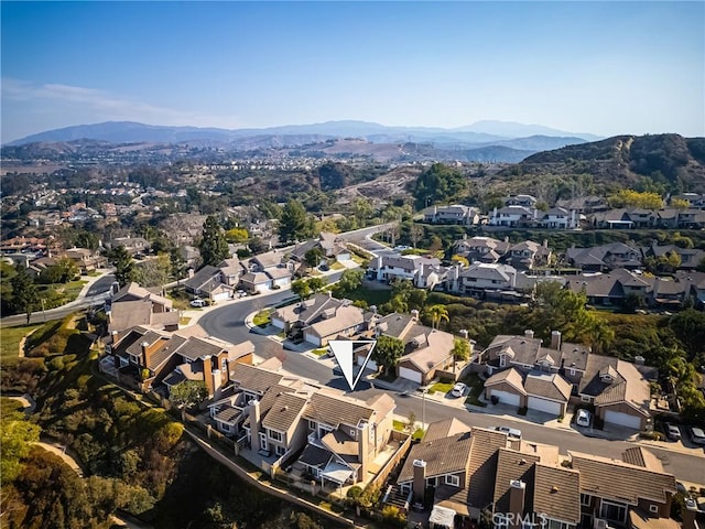 birds eye view of property featuring a mountain view