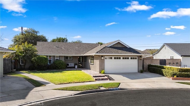 ranch-style house featuring a garage and a front lawn