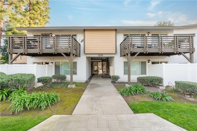 view of front of home with a balcony