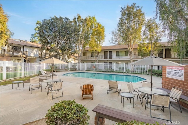 view of swimming pool featuring a patio