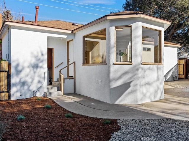 exterior space with entry steps and fence