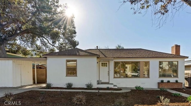 view of front of house featuring a carport