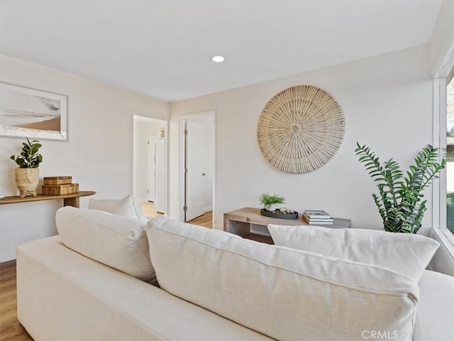 living area with recessed lighting and wood finished floors