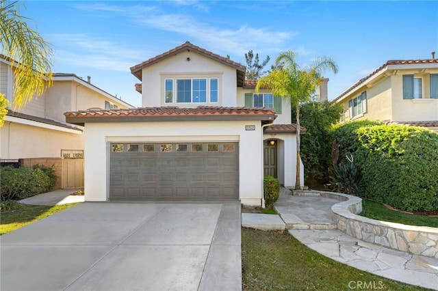 mediterranean / spanish-style house featuring a garage