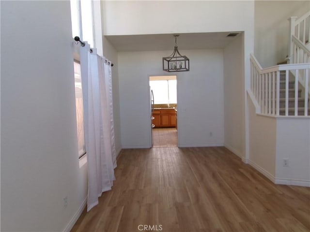 unfurnished dining area with wood-type flooring