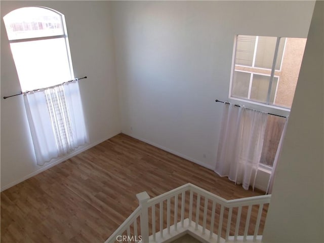 spare room with hardwood / wood-style floors