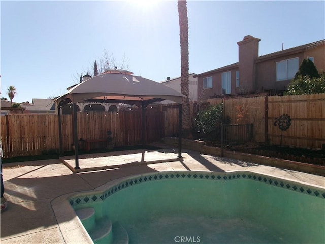 view of swimming pool with a gazebo and a patio