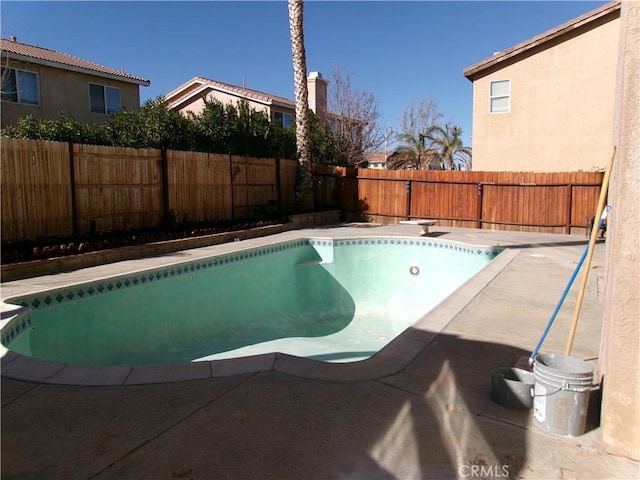 view of pool featuring a diving board