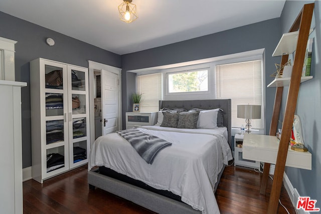 bedroom featuring dark hardwood / wood-style floors