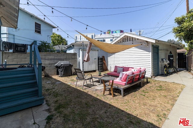 rear view of property with a patio area, a yard, and an outdoor hangout area