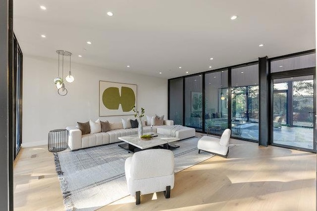 living room featuring floor to ceiling windows