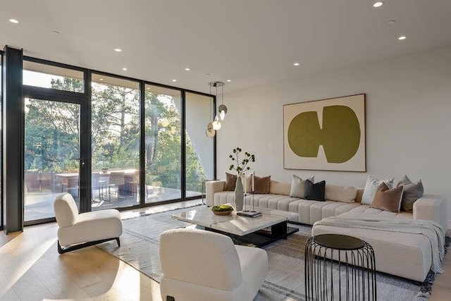 living room featuring floor to ceiling windows