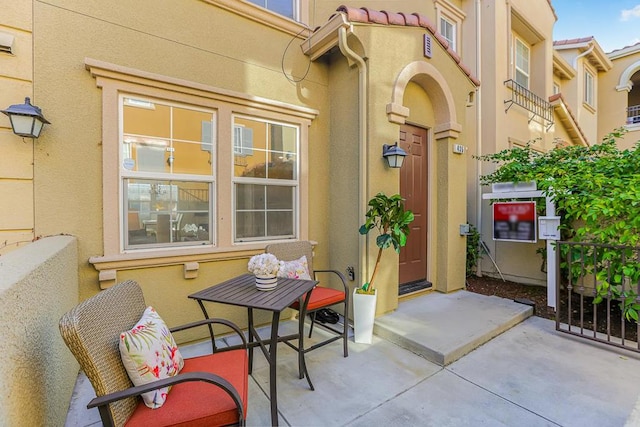 property entrance with a patio