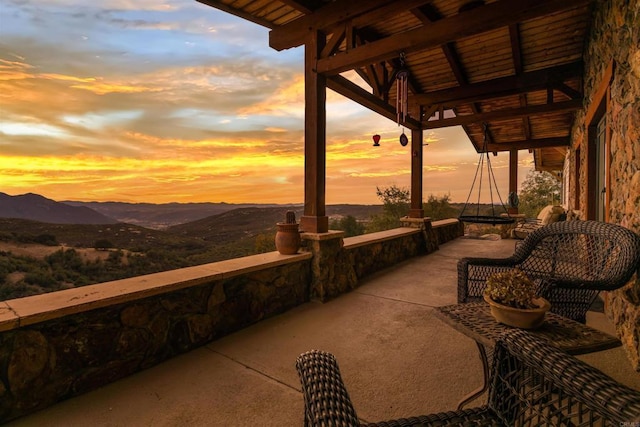 view of patio / terrace with a mountain view