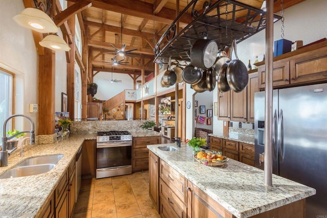 kitchen with brown cabinetry, wood ceiling, appliances with stainless steel finishes, beamed ceiling, and a sink