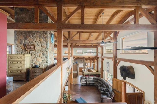 hall featuring lofted ceiling with beams, wood ceiling, and wood finished floors