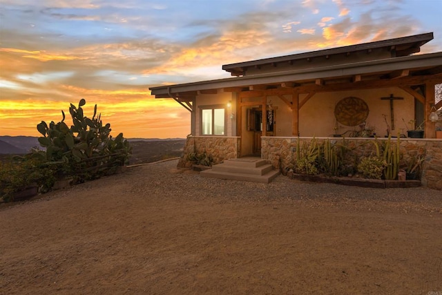 view of front of house featuring stucco siding