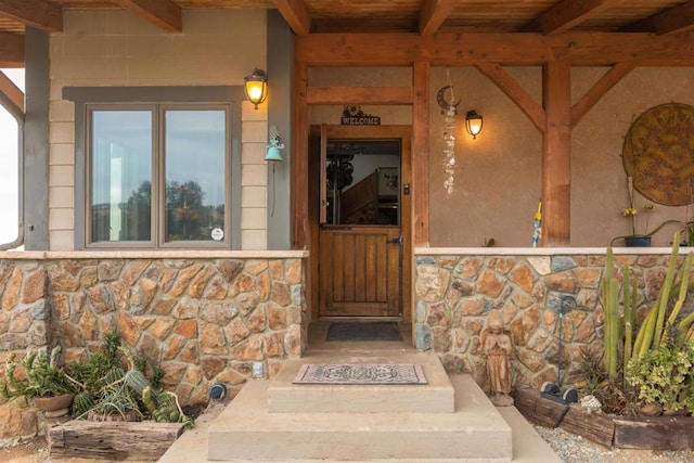 view of exterior entry with stone siding