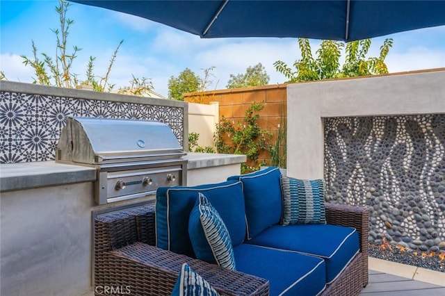 view of patio / terrace with an outdoor kitchen and area for grilling